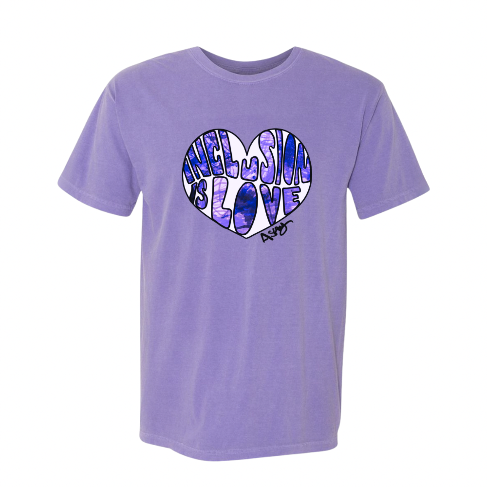 A purple graphic t-shirt with the phrase 'INCLUSION IS LOVE' printed in a heart shape on the front Art by Ashley Caldwell