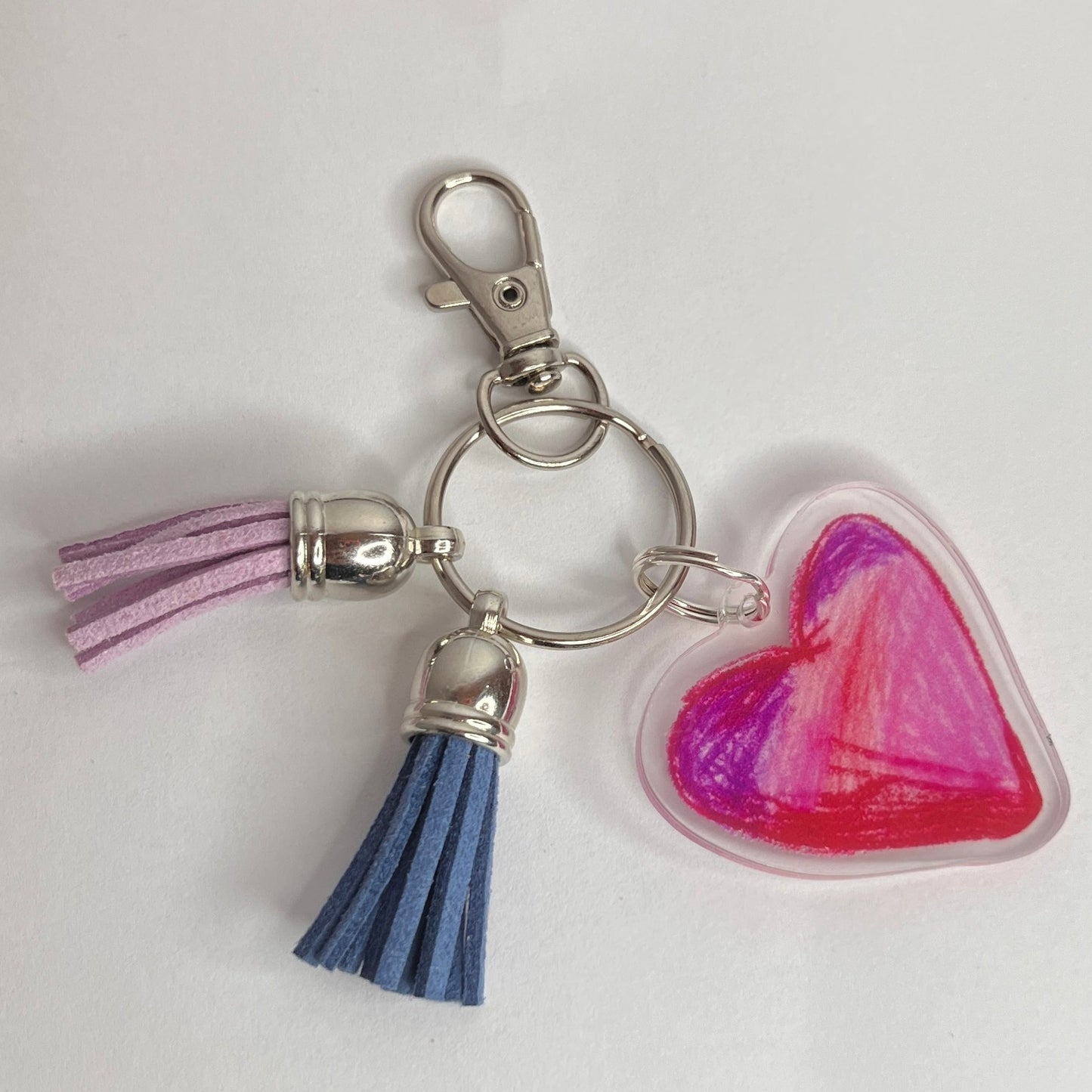 lobster clasp and silver keyring Acrylic keychain charm with MY HEART pink and purple design by self-advocate artist Ashley Caldwell with tassel
