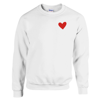 A white crewneck sweatshirt with a 2.5-inch 3D silicone heart red heart printed on the left chest, displayed on a clean white background.