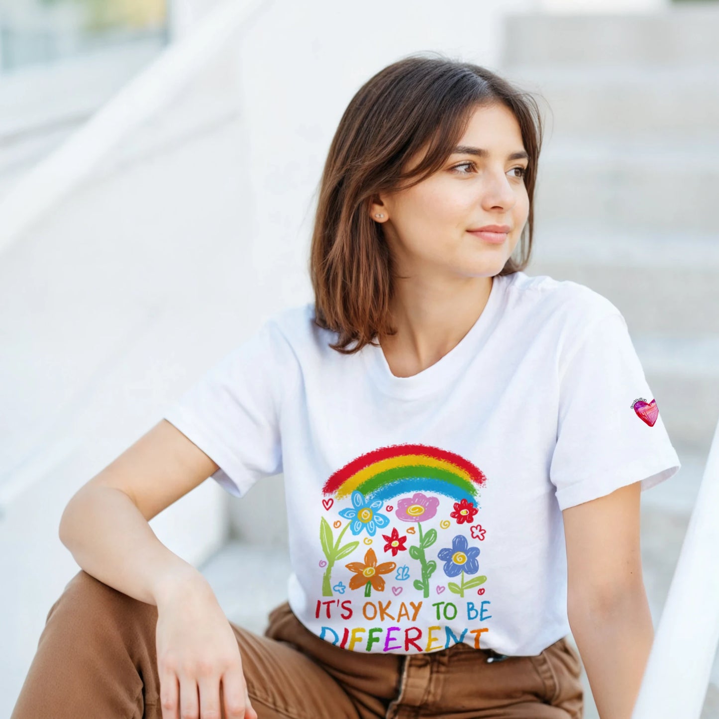 A women wearing It's okay to be different t-shirts 