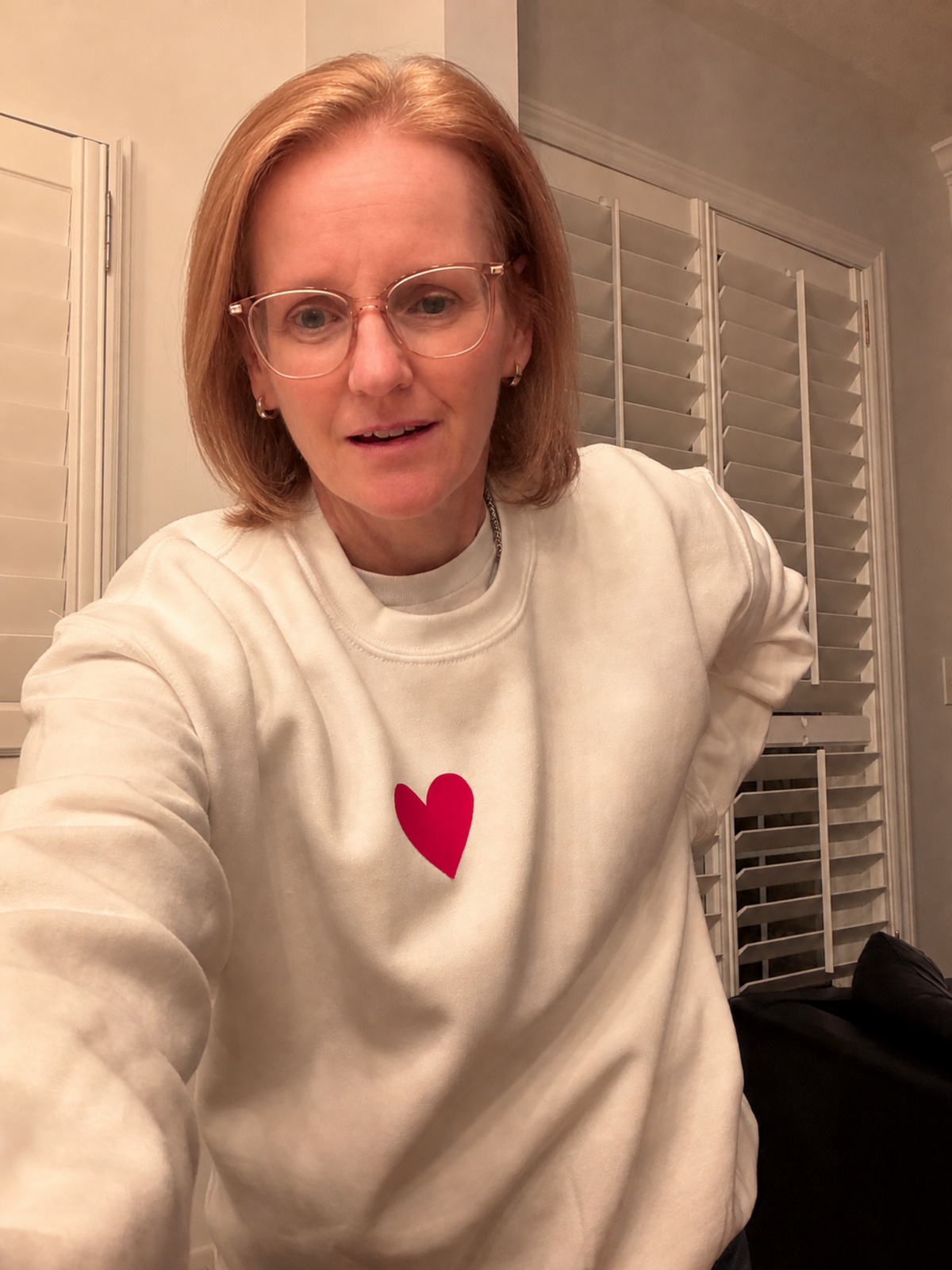 White crewneck sweatshirt with 3D silicone heart. 