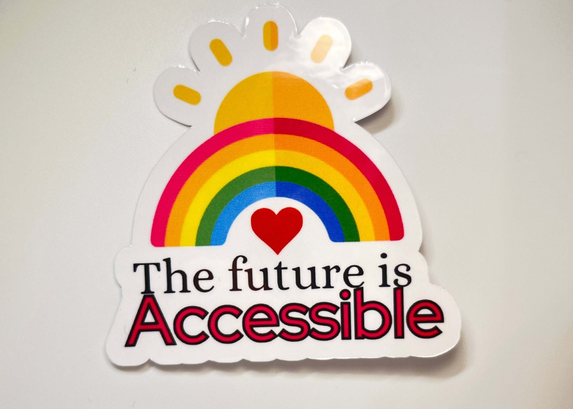 Sticker with rainbow, heart, and text 'The future is Accessible' on a white background